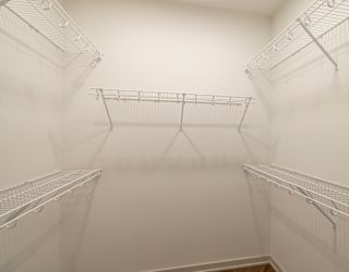 Empty white shelves in a room.