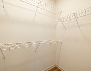Empty wire shelves in a room.