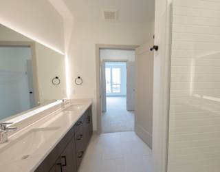 Primary bathroom in the C4 two bedroom two bathroom floor plan at The Mera in St. Louis Park, Minnesota