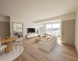 Living room in the CC3 two bedroom plus den, two bathroom floor plan at The Mera in St. Louis Park, Minnesota