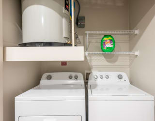 the laundry room has two washers and a dryer
