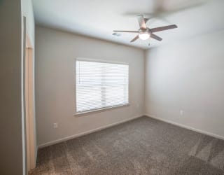a bedroom with a ceiling fan and a window at Avery Ranch, Texas, 78717