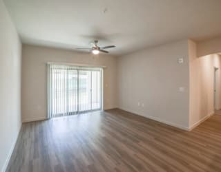 an empty living room with a ceiling fan at Avery Ranch, Austin, Texas