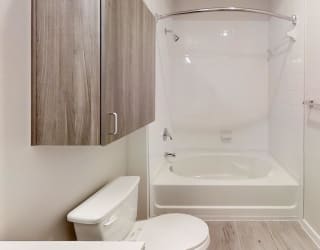 a bathroom with a shower and a toilet in it