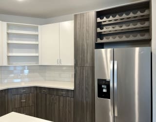 a modern and funky half bathroom reveal with black and white tile in a modern laundry space