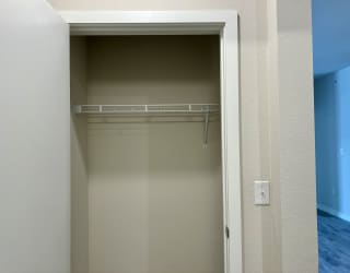 a walk in closet in a 555 waverly unit