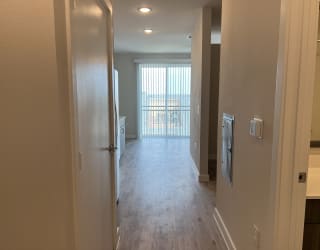a look down the hallway of a bedroom apartment at the historic electric building apartments in fort worth