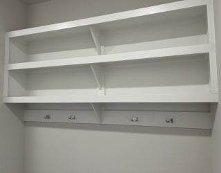 a close up of the shelving in the laundry room
