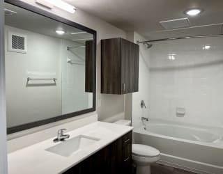 a bathroom with a sink toilet and bathtub