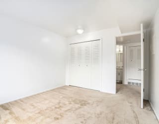 bedroom with large window at Apple Ridge Apartments, Michigan, 49534