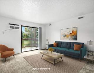 A living room with a slider to a balcony  at Apple Ridge Apartments, Walker, MI