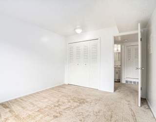 A bedroom with a large closet at Apple Ridge Apartments, Walker, MI, 49534