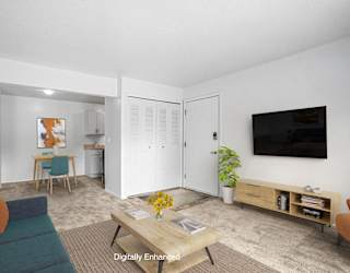 A dining and living room with carpeting  at Apple Ridge Apartments, Walker, MI