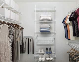 Walk in closet with wardrobe organizers at Brentwood Park Apartments in LaVista, NE