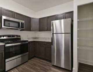 A kitchen with a pantry at Copper Creek Apartment Homes, Maize, 67101
