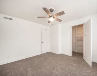 Large living room with ceiling fan at The Crossings Apartments, Grand Rapids, MI