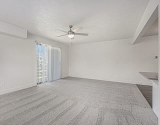 Oversized living room leading to private balcony at The Crossings Apartments, Michigan, 49508