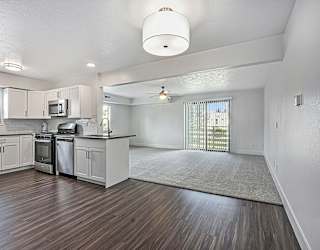 A kitchen with white cabinets at The Crossings Apartments in Grand Rapids, MI