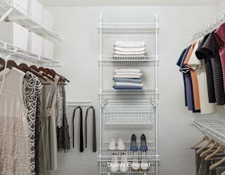 a walk in closet with organizers at Dupont Lakes Apartments in Fort Wayne, IN