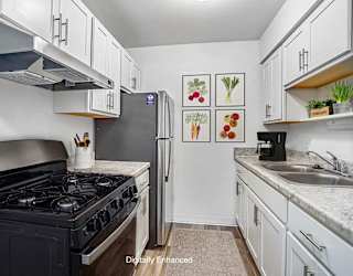 a kitchen with stainless steel appliances at Fairlane Apartments in MI 49037