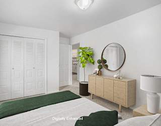 bedroom with a large closet at Fairlane Apartments in Springfield, MI