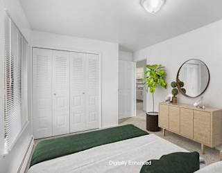 A large bedroom with a closet at Glen Oaks Apartments, Michigan, 49442