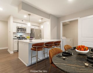 a kitchen and dining area in a 555 waverly unit at Hillside Apartments, Michigan, 48393