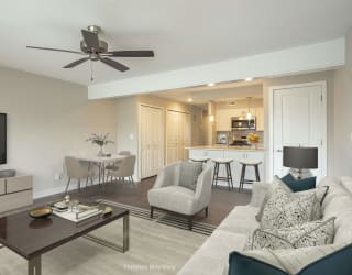 a living room and kitchen in a 555 waverly unit at Hillside Apartments, Wixom, MI, 48393