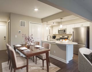a kitchen and dining area in a 555 waverly unit at Hillside Apartments, Wixom, MI