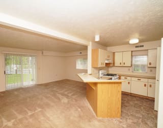 a kitchen with an island in the middle of it  at Hurwich Farms Apartments, Indiana, 46628