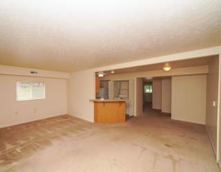 the living room and kitchen of an empty house  at Hurwich Farms Apartments, South Bend, 46628