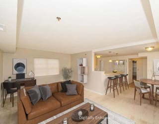 a living room and dining room with a couch and a table