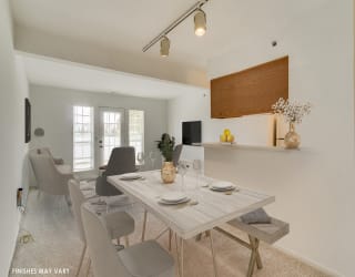 Dining Area with Living Room View at Northport Apartments, Macomb, Michigan