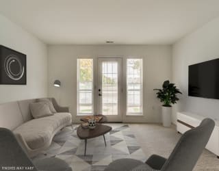 Cozy Living Room with Carpeting at Northport Apartments, Macomb, MI