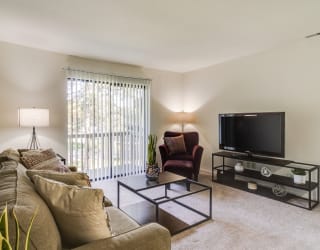 Marigold Living Room at The Village Apartments, Wixom, MI