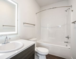 a bathroom with a sink toilet and a shower at Meadowbrooke Apartment Homes, Michigan, 49512