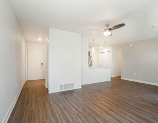 an empty living room with a ceiling fan at Meadowbrooke Apartment Homes, Grand Rapids, 49512