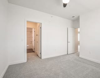 an empty living room with white walls and carpet at Meadowbrooke Apartment Homes, Grand Rapids, 49512