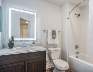 a bathroom with a sink toilet and a shower at Meadowbrooke Apartment Homes, Grand Rapids, 49512