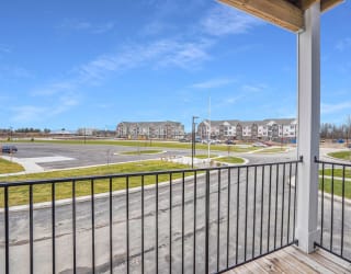 the view from the balcony of a building with a parking lot at Meadowbrooke Apartment Homes, Grand Rapids, MI, 49512