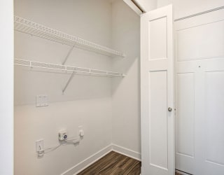 the closet in a bedroom of a home with white doors at Meadowbrooke Apartment Homes, Grand Rapids, Michigan