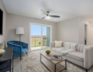 a living room with a couch and a coffee table at Meadowbrooke Apartment Homes, Grand Rapids, 49512