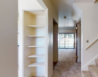 a view of a house with stairs and a hallway at Mount Royal Townhomes, Kalamazoo, 49009