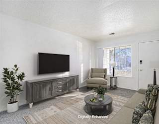 Main floor living with large window at Newport Village Apartments, Portage, MI