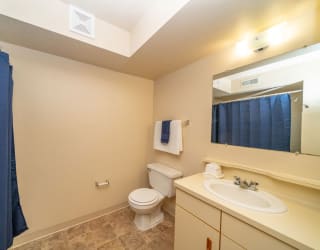 a bathroom with a sink toilet and a shower at North Pointe Apartments, Indiana, 46514