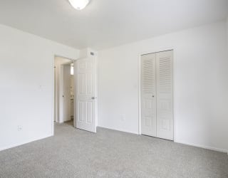 Bedroom with a walk in closet at North Pointe Apartments, Indiana, 46514