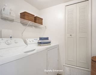 a laundry room with a washer and dryer at North Pointe Apartments, Indiana, 46514