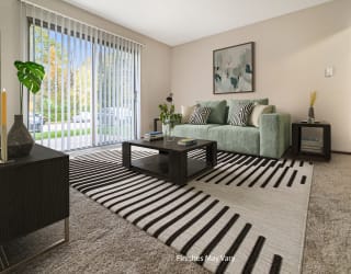 a living room with a couch and a coffee table in front of a sliding glass door at Timberlane Apartments, Peoria, 61615