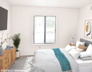 a bedroom with a window at Seville Apartments, Michigan, 49009