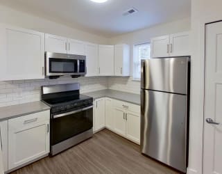 end style kitchen with a window at Signature Pointe Apartment Homes in Athens, AL